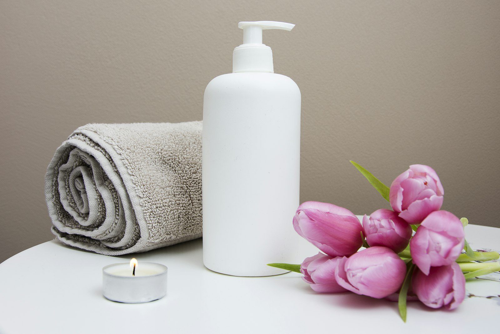 Towel, lotion and tulips