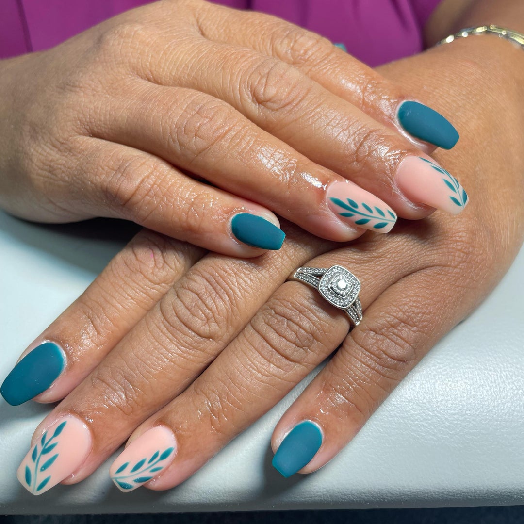 Gel nails with leaf art done at the salon